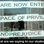 paper signs hanging on a window